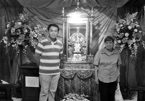 Ador and his mother, Adoracion, with the image of the Sto. Niño de Cebu.