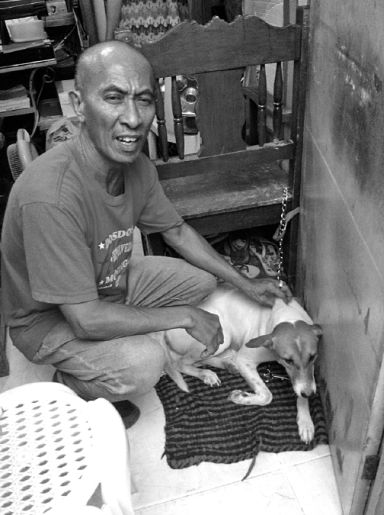 Rogelio Agusto with his dog Lotlot. CDN phot/Dominic D. Yasay