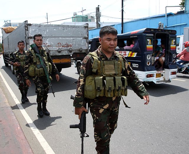  In this file photo dated Sept. 25, 2016, Philippine Army soldiers from the 47th Infantry Battalion under the Armed Forces’ Central Command based in Camp Lapu-Lapu, Cebu City were deployed to secure crowded areas such as the South Bus Terminal and the Cebu City Medical Center. 