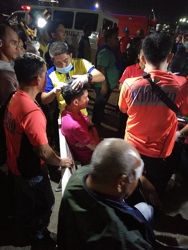 Emergency responders attend to the injured passengers of MV St. Braquiel after their arrival at the Pier 4 at the Cebu port, more than an hour later from the sea accident. CDN PHOTO/CHRISTIAN MANINGO
