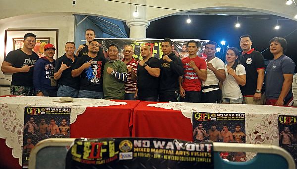 Yaw-Yan ArDigma fighters and organizers headed by Master Ekin Caniga Jr. (sixth from left) gather after a press conference at the Cul de Sac restaurant.  CDN PHOTO/LITO TECSON