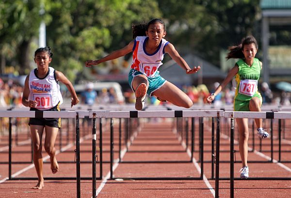 An athlete competes in the hurdles event of the 2017 edition of the CVIRAA.