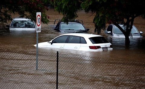 Floodwaters enter in the parking lot outside the Robina Hospital on the Gold Coast as severe rain continue throughout south-east Queensland following cyclone Debbie on March 30, 2017. /AFP