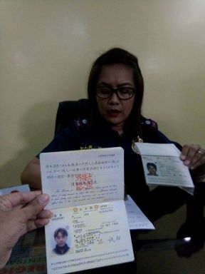 Acting CIDG-7 Director, Supt. Royina Garma shows the passport of the Japanese suspect who allegedly sexually abused and attempted to commit child prostitution.  (CDN PHOTO / FE DUMABOC)