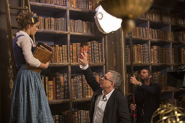 Emma Watson as Belle (left) with director Bill Condon (center)