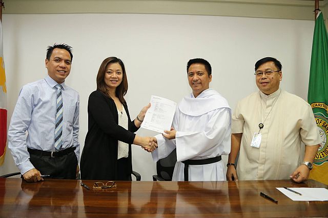 From left: Mr. Leandro Anonuevo, IELTS Business Development Manager; Maria Aurora Dela Viña, IDP country director; USJ-R President Fr. Cristopher Maspara, OAR and USJ-R VP for Administration Fr. Emilio Jaruda Jr., OAR after the signing of agreement. (CONTRIBUTED)