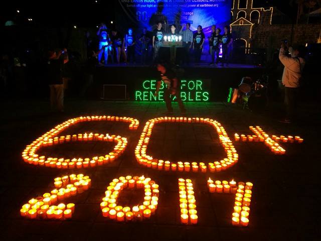 Participants to this year’s Earth Hour observance set up candles to form the “60+2017” logo at the Plaza Independencia.  (CDN PHOTO/CHRISTIAN MANINGO)