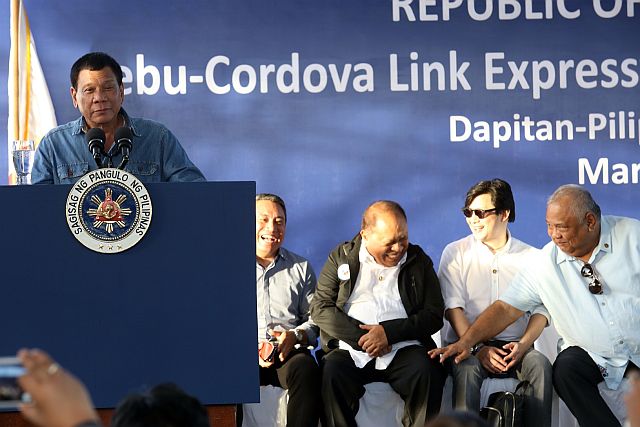 Presidential Adviser for Legislative Affairs Adelino Sitoy (seated second from left) shares a laugh with Presidential Assistant for the Visayas Michael Dino and Executive Secretary Salvador Medieldea as President Rodrigo Duterte cracks some jokes during his message for the groundbreaking of the Cebu-Cordova Link Expressway in this March 2, 2017 file photo
