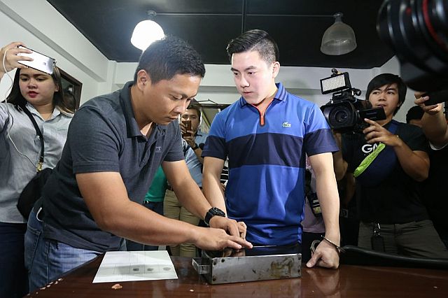 Road rage suspect David Lim Jr. is being fingerprinted at the  Regional Special Operation Group based in Camp Sergio Osmeña after his surrender early on Tuesday, March 21, 2017. (CDN PHOTO/JUNJIE MENDOZA)