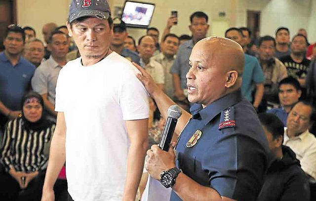 Franz Sabalones, here presented by PNP Director General Ronald dela Rosa, has several assets including a P76 million savings in three bank accounts. The Court of Appeals recently issued an order freezing all his properties. (INQUIRER PHOTO)