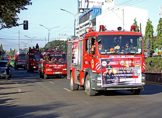 Cebu City firemen join motorcade to open the Fire Prevention Month. (CDN PHOTO/LITO TECSON)