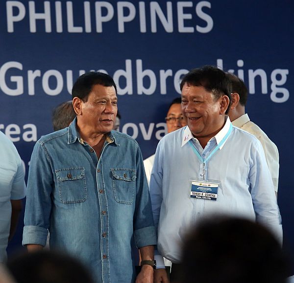 President Rodrigo Duterte and Cebu City Mayor Tomas Osmeña share a laugh at the groundbreaking site 