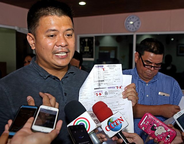 Dumanjug Mayor Efren Gica shows to reporters a copy of  his counter-affidavit after filing a Motion for Reconsideration before the Office  of the Ombudsman- Visayas last month. (CDN FILE PHOTO)
