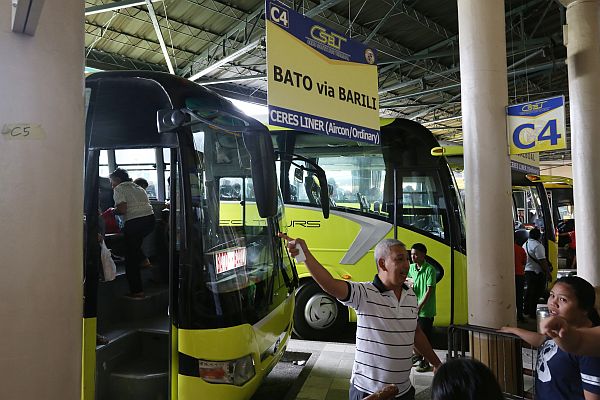 Cebu South Bus Terminal manager Joey Herrera shows the newly installed signages in the terminal as part of their preparation for the Holy Week. CDN PHOTO/JUNJIE MENDOZA