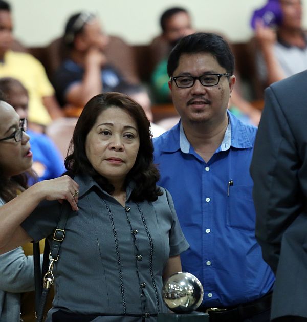 SHOW CAUSE ORDER: Alita Pulga (left), Land Transportation Office Central Visayas (LTO-7)  officer in charge, and former LTO-7 director Arnel Tancingko are seen entering the Cebu City Council session hall on Tuesday, March 28, 2017. Ms. Pulga announces that show cause orders, which will explain why their driver’s licenses should not be revoked, will be issued today to David Lim Jr. and Ephraim Nuñal for the March 19 road rage incident, and to David Lim Sr.  for the March speeding incident that killed a fish vendor. CDN PHOTO/JUNJIE MENDOZA