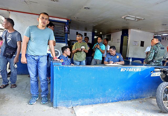 At least seven private individuals in civilian clothes have restricted the media from going near the detention cell, and taking photographs and videos of David Lim Jr. at the Cebu City Police Office stockade, (CDN PHOTO/LITO TECSON)