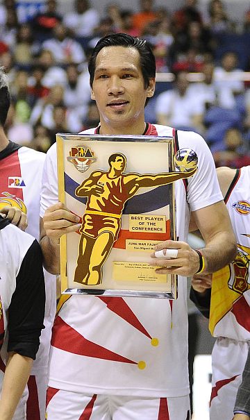 Cebuano big man June Mar Fajardo of the San Miguel Beermen holds his Best Player of the Conference plaque prior to the start of Game 4 of the Philippine Cup Finals. inquirer