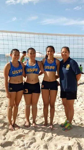 Members of the University of Southern Philippines Foundation beach volleyball team with head coach Yolanda Rizarri. contributed photo