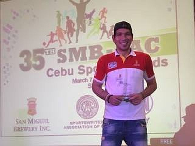 Cebuano PBA player June Mar Fajardo is all smiles after receiving his Athlete of the Year award in the 35th SMB-SAC Sports Awards yesterday at the SM City-Cebu. 