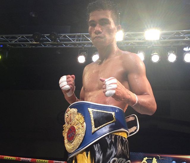 Kenny Demecillo wears the WBF Asia-Pacific bantamweight belt after a unanimous win over Jestoni Autida in the co-main event of “Who’s Next?” Pro-Boxing Series last December at the Mandaue City Cultural and Sports Complex. (CDN FILE)