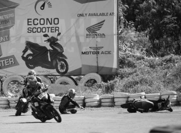 A rider falls after losing his balance while negotiating a curve in the Honda Cebu Dream Cup at the Kartzone track in F. Cabahug Street, Cebu City. CDN PHOTO/LITO TECSON