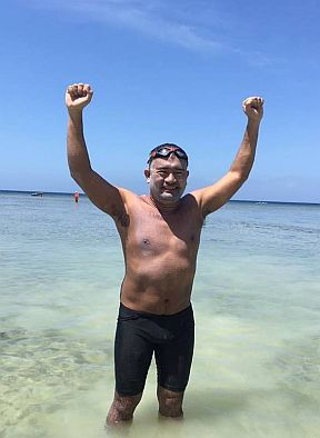 Ingemar Macarine celebrates his successful swim from Limasawa Island to Southern Leyte. CONTRIBUTED PHOTO