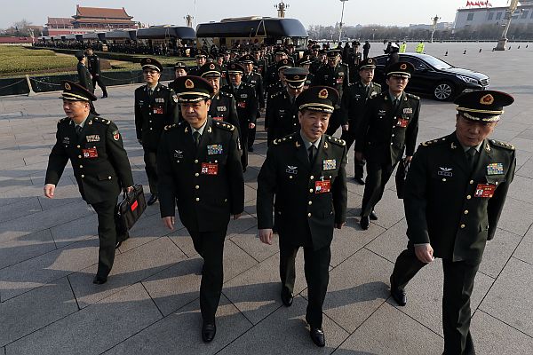 Delegates from China’s People’s Liberation Army (PLA) arrive at the Great Hall of the People to attend a plenary session of the National People’s Congress in Beijing, Saturday, March 4, 2017. China will raise its defense budget by about 7 percent this year, a government spokeswoman said Saturday, continuing a trend of lowered growth amid a slowing economy.  AP Photo