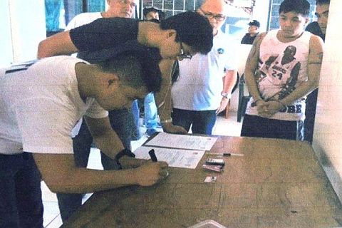 A drug suspect undergoes a booking proceeding in Leyte.  /Inquirer Visayas 