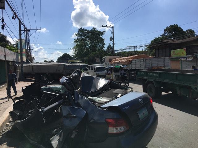 A vehicular collision involving a Toyota Vios and a cargo truck along the highway of Minglanilla is causing heavy traffic in the area. (CDN PHOTO/ JOSE SANTINO BUNACHITA)