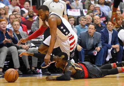 Washington Wizards guard John Wall chases a loose ball against Atlanta Hawks guard Dennis Schroeder. /AP Photo