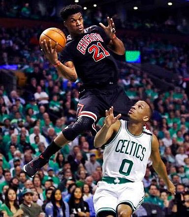 Chicago's Jimmy Butler against Boston's Isaiah Canaan. (AP)
