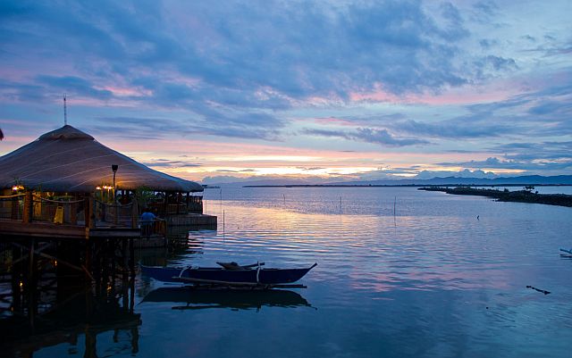 Native Floating Restaurant at Sunset in Cordova, Mactan Island, Cebu. (Travel + Leisure)