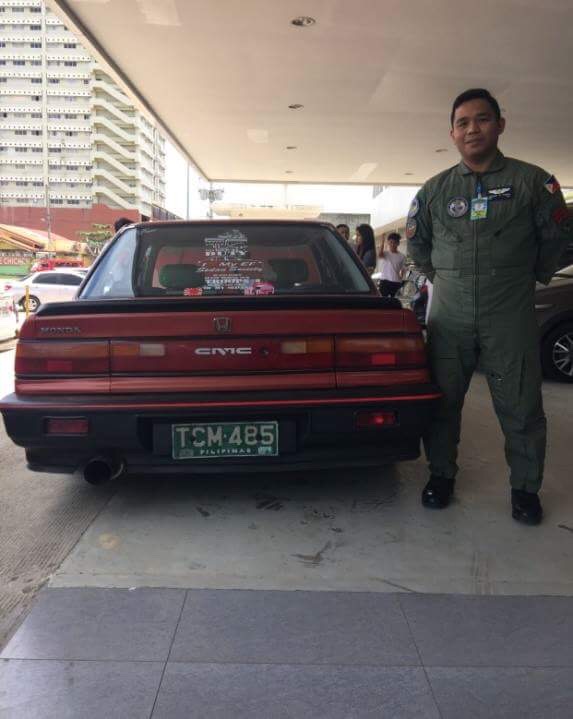 Staff Sgt. Henrick Garcia of the Philippine Air Force and his winning entry for Honda Cars Cebu's "oldest Civic" contest. /contributed