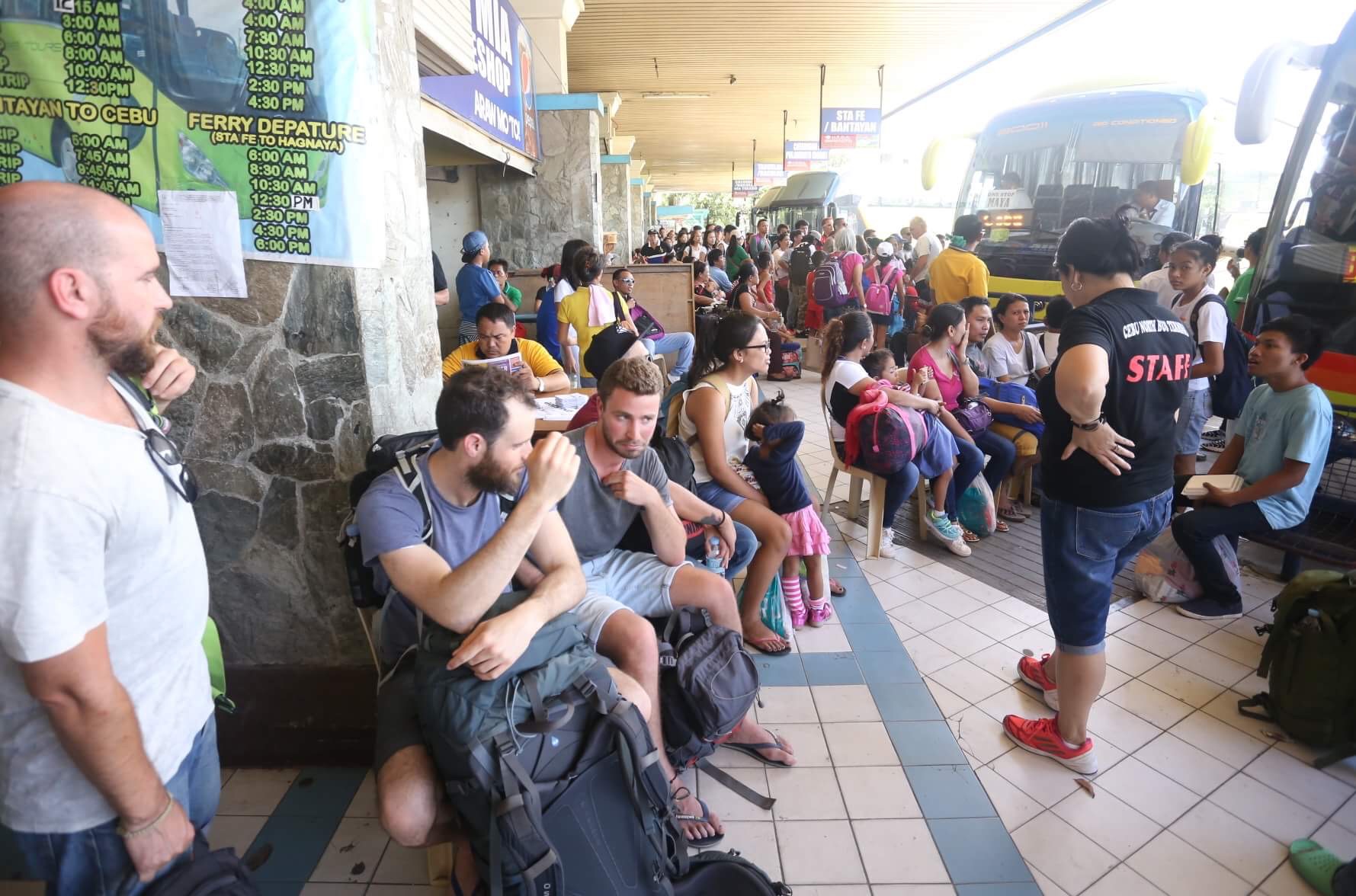 Tourists and locals wait for their bus rides at the North Bust Terminal (CDN PHOTO/ LITO TECSON) 