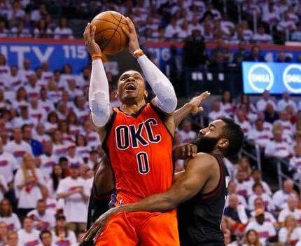 Oklahoma's Russel Westbrook against Houston's James Harden. (AP)
