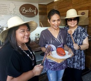 Raquel Choa (center) shows one of her chocolate products during the launching of Chocolate Chamber’s Batirol. CDN PHOTO/TRICIA RODRIGO