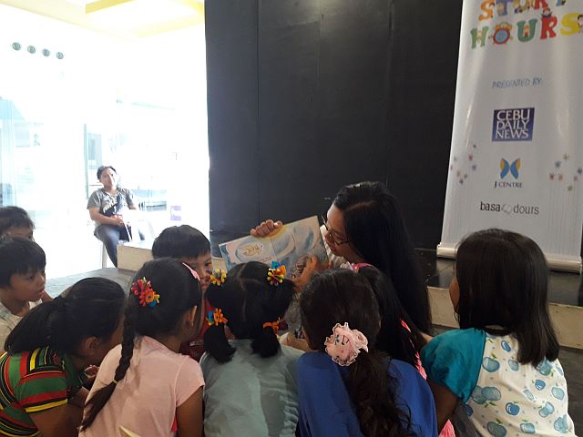 Children listen intently to the story “Gaya’s Gift,” a carabao who wanted to learn the skills of other animals. The story was written by Jenny Evans and illustrated by Junn Esteban. (CONTRIBUTED PHOTO/VIANCA ABELLANA)