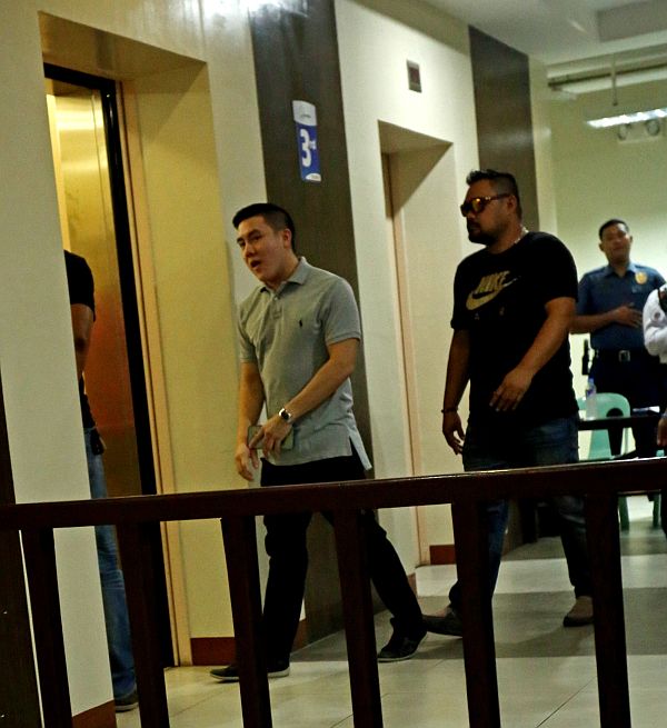 Road rage shooting suspect David Lim Jr. (left) leaves the Prosecutor’s Office after his arraignment for frustrated homicide has been reset. CDN PHOTO/LITO TECSON
