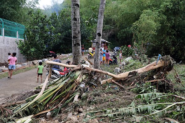 Debris are left at the corner of the road, a scene left from last Sunday’s flash flood in Carmen town in northern Cebu. CDN PHOTO/TONEE DESPOJO