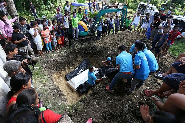 Burial of the 4 slain ASG bandits at Clarin Public Cemetery in Clarin town, Bohol. / Junjie Mendoza