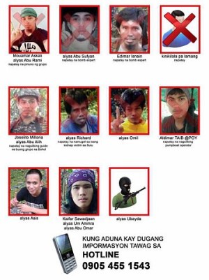A poster released by the Armed Forces of the Philippines marks with a letter X the photos of 8 Abu Sayyaf members who have been killed and of 3 still being hunted.