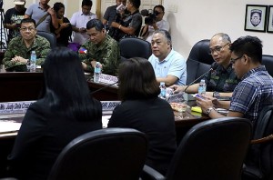 Cebu Gov. Hilario Davide III is shown here receiving updates from the military and the police on the situation in Bohol province.  CDN File Photo