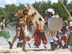 HISTORIC BATTLE. Ferdinand Magellan (right) and  Datu Lapu-Lapu (left) portrayed by “Pinoy Boy Band” finalists James Ryan Cesena and Tony Labrusca, respectively, reenact  along with school volunteers at the Lapu-Lapu Shrine in Barangay Mactan, the famous Battle of Mactan which was fought in the Philippines on April 27, 1521. (CDN PHOTO/JUNJIE MENDOZA)