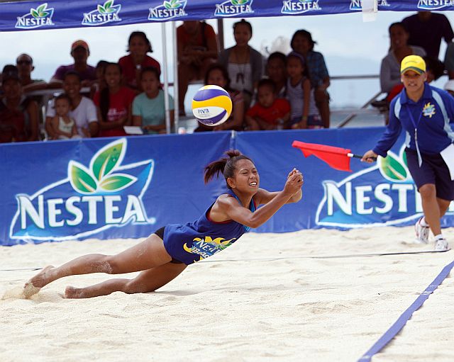 Rica Rochelle of USPF dives to save the the ball in this 2013 photo of the Nestea Beach Volley tournament in Moalboal town, southwestern Cebu. CDN PHOTO/LITO TECSON