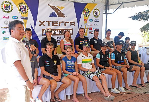 Cebu Provincial Administrator Atty. Mark Tolentino (left) presents the 15 Pro triathletes competing in the XTerra 2017 Danao at the Coco Palm Resort in Danao City, Saturday.  (CDN PHOTO/LITO TECSON)