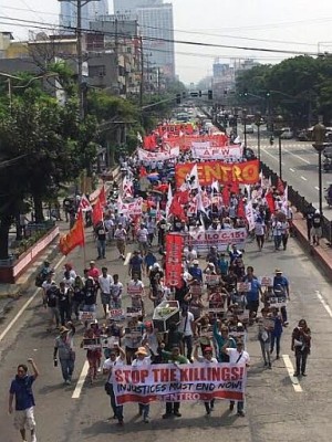 Workers’ groups march on the streets of Manila, calling for higher wages and an end to contractualization on Labor Day.  Photo from the Sentro ng Nagkakaisa at Progresibong Manggagawa.