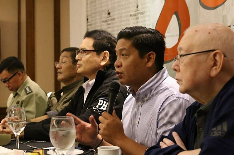 Cebu Provincial Board Member Celestino Martinez (holding the microphone) explains his position on the arming of barangay officials in the weekly 888 News Forum.  CDN Photo/Junjie Mendoza