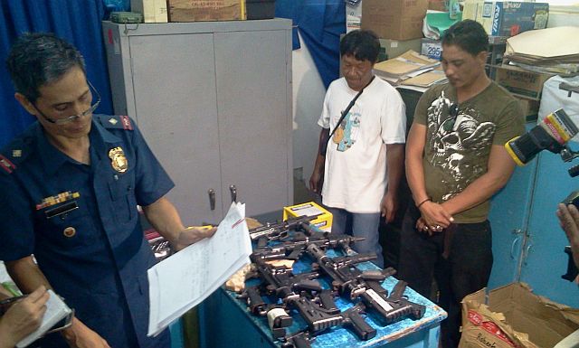 Insp. Mario Retuya, the supply officer of Mandaue City Police Office, shows the firearms with expired licenses that were turned over to them by Mandaue City. These are expected to be reissued by the city government once the Licenses to Own and Possess Firearms (LOTPF) are completed. (CDN PHOTO/NORMAN MENDOZA) 