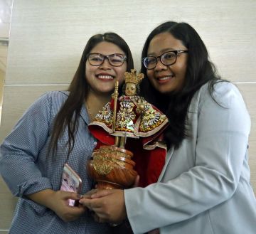 Bar topnotchers Karen Mae Calam Bar passer number 1 (left) and Anne Margaret Momongan number 7 celebrates after hearing they top on the bar exames at their office in SGV accounting firms. The two bar topnotchers studies their law at the University of San Carlos. (CDN PHOTO/LITO TECSON)