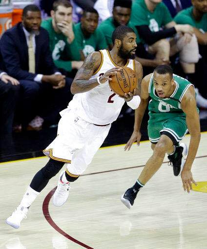 Cleveland Cavaliers' Kyrie Irving (2) drives against Boston Celtics' Avery Bradley (0) during the first half of Game 4 of the NBA basketball Eastern Conference finals. AP Photo 